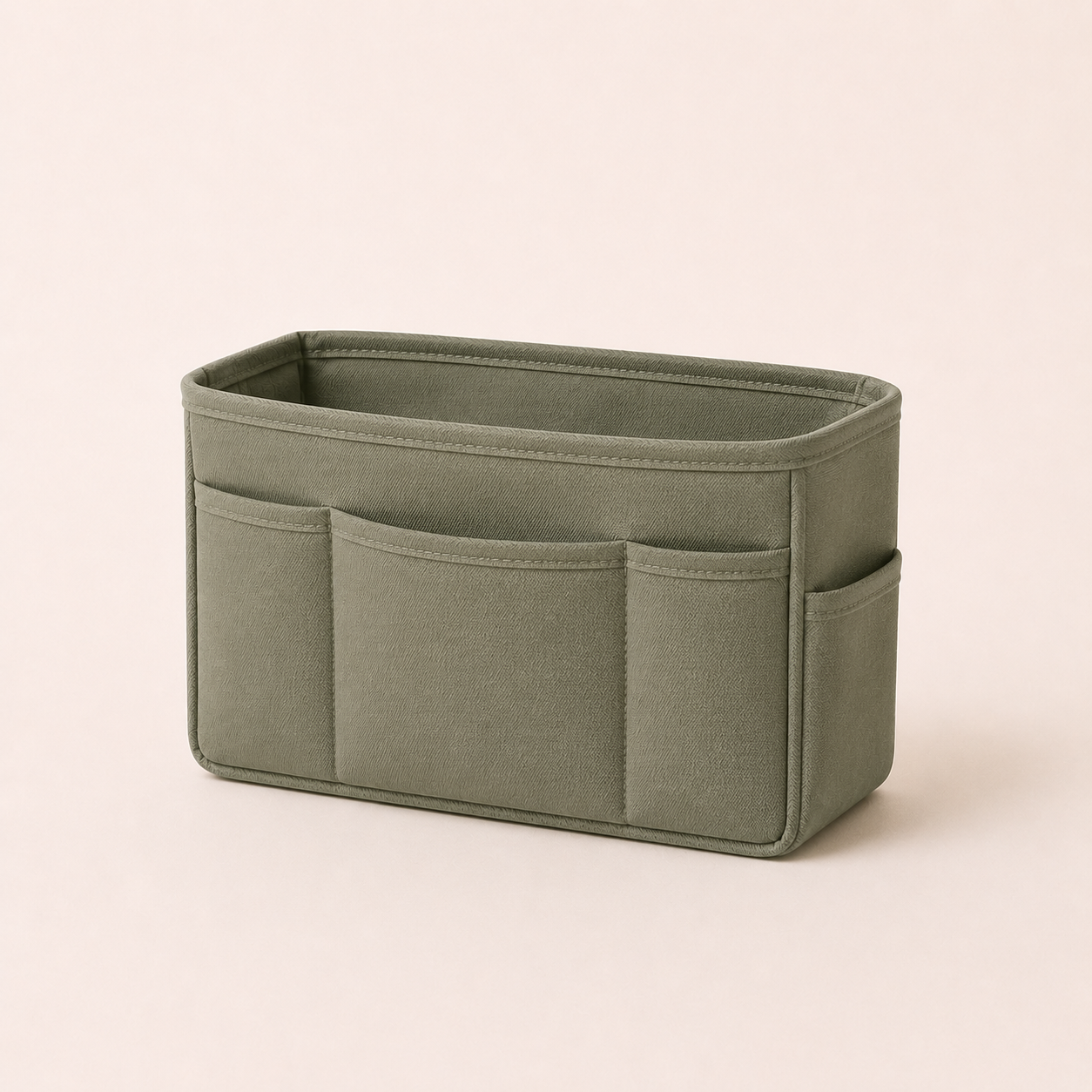 Medium sage green room organizer pouch on a clean neutral background