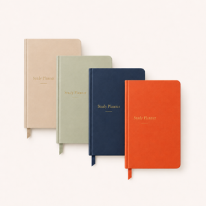 Beige, light green, navy blue and brick orange study planners arranged overlapping on a light neutral background